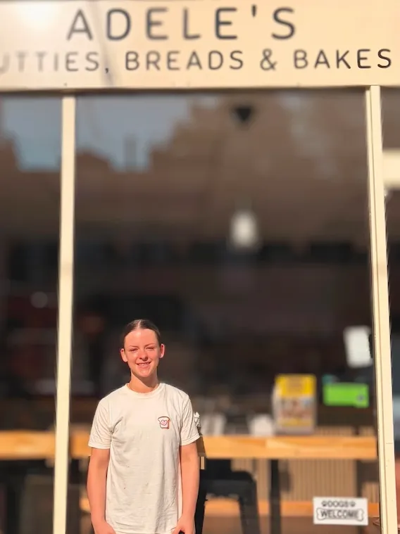 Adele in front of the shop
